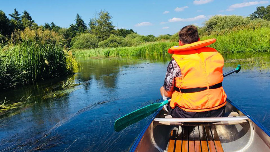 Eco-friendly vacation with a canoe on the Gudenå River.
