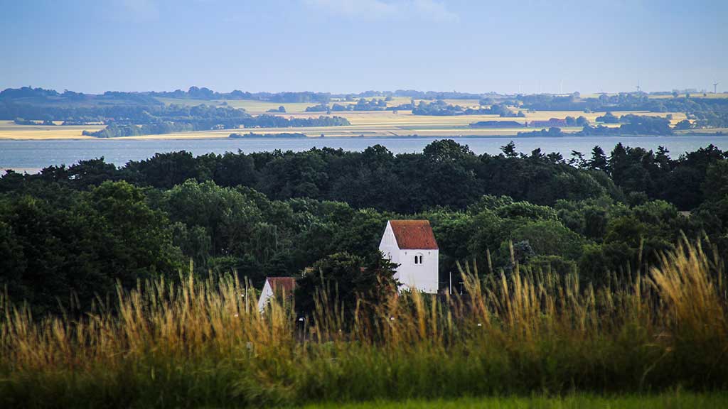View of Søvind Church and Horsens Fjord from the hiking trail Banestien Horsens-Odder