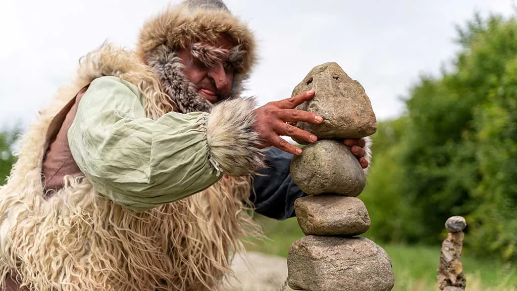 The troll is building a stone arrangement in the Fairy Tale Forest