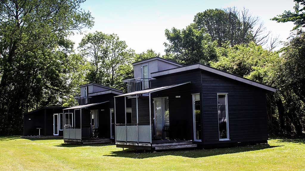 Large cabins with a terrace at Hjarnø Camping