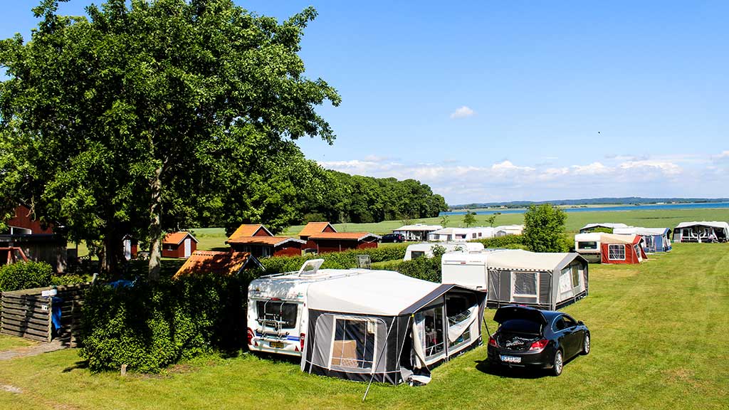 Aerial photo of Hjarnø Camping with Horsens Fjord in the background
