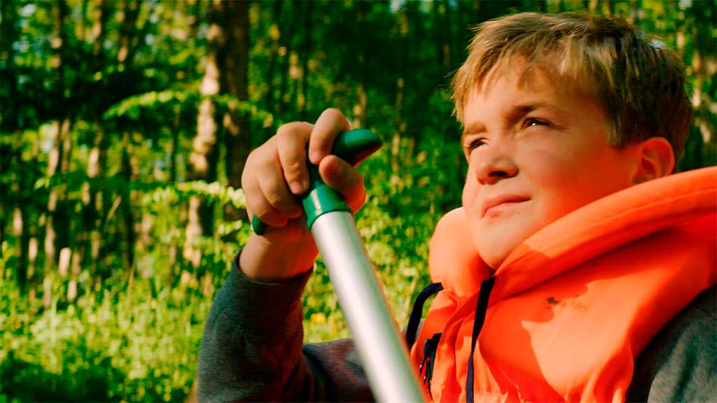 Boy on a canoe trip on the Gudenå River.