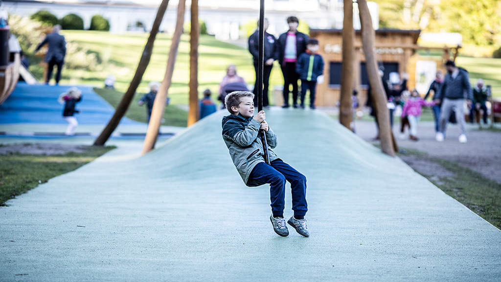 A girl and a boy are walking in the forest