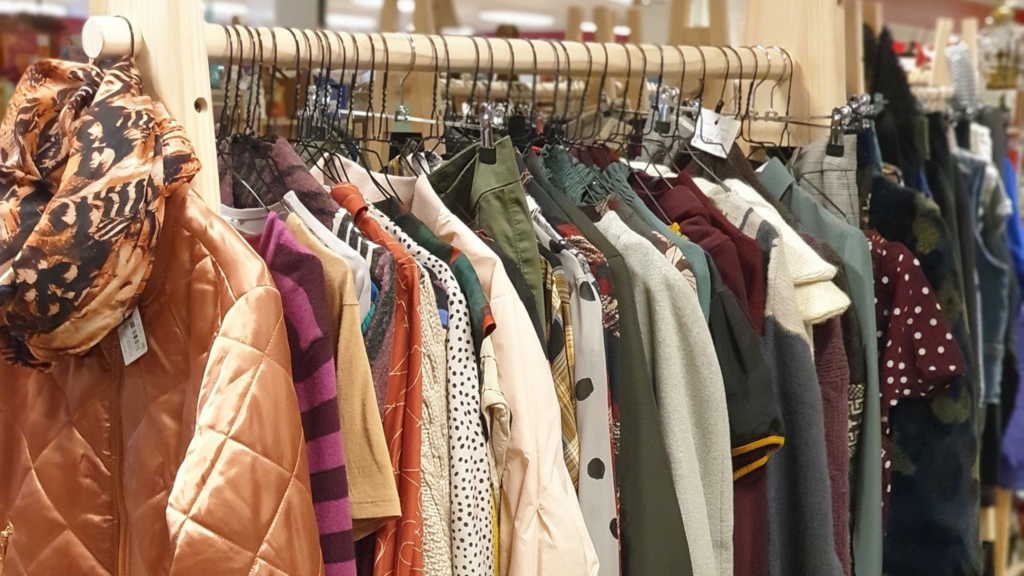 Fashion clothes on the shelves at the flea market Kirppu in Horsens