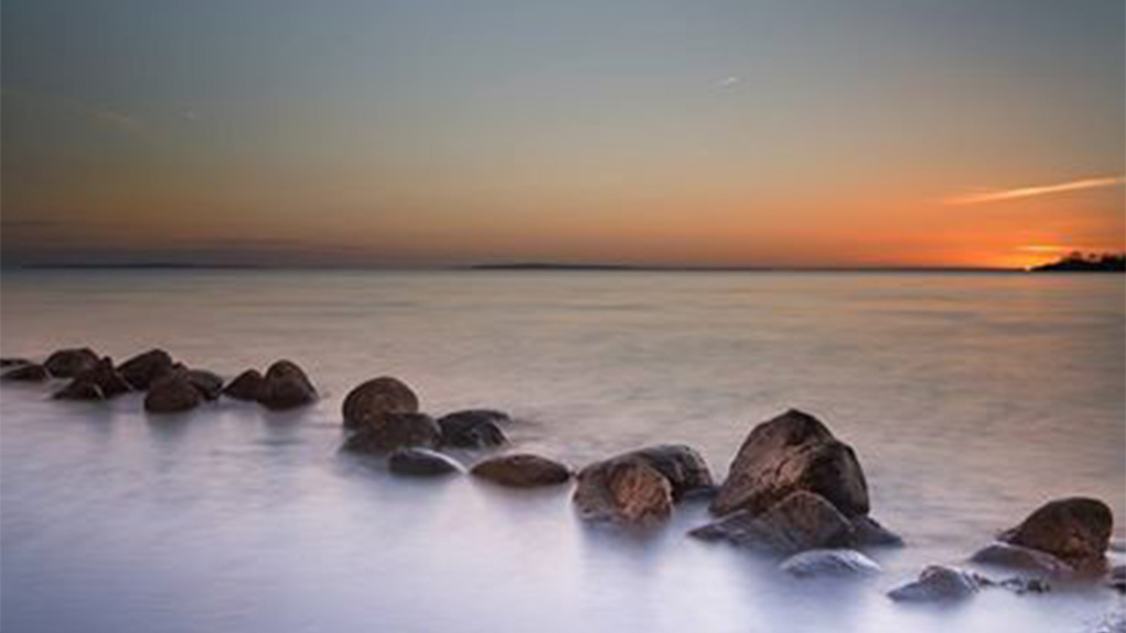 Sunset over the stone dikes at Bjørnsknude near Juelsminde