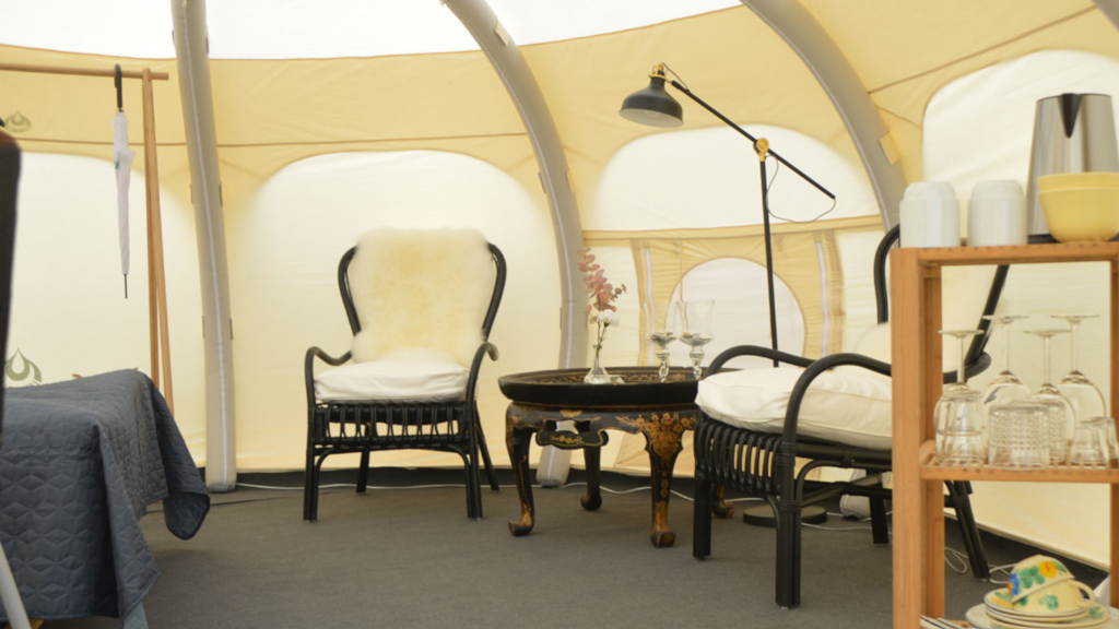 Seating area in a glamping tent at NFJ Naturist - Familiecamping