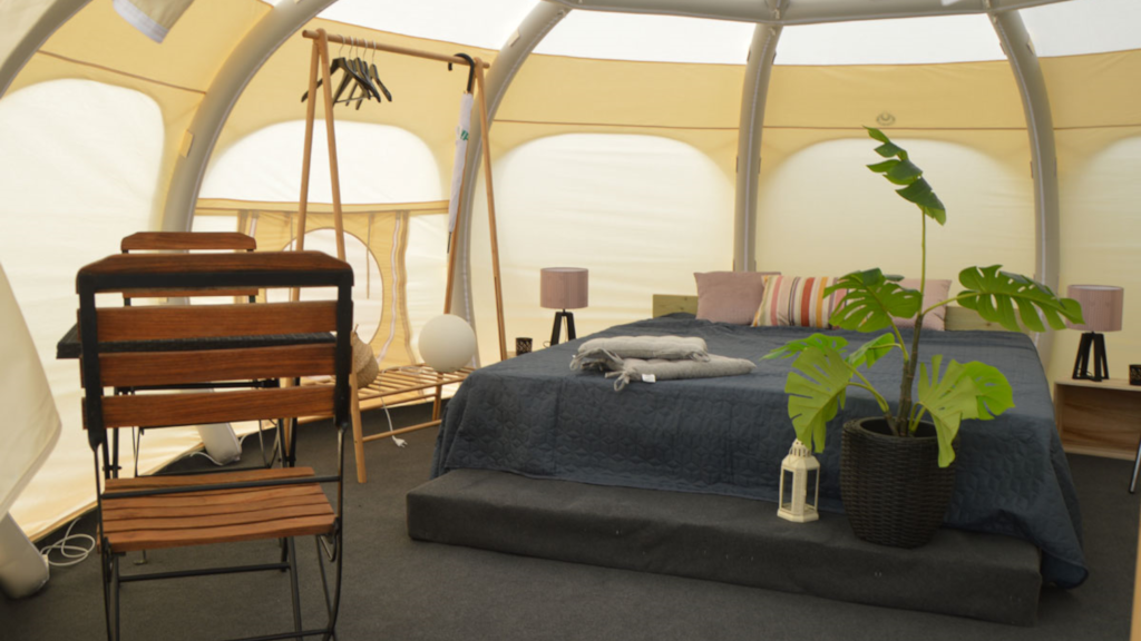 Bed and interior in a glamping tent at NFJ Naturist - Familiecamping