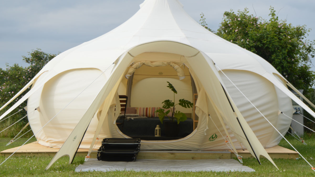 Seating area in a glamping tent at NFJ Naturist - Familiecamping