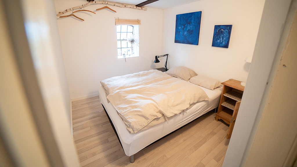 Double bed in the bedroom of a summer apartment on Endelave
