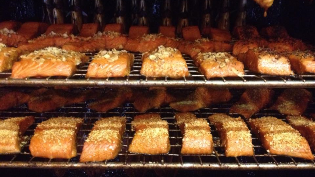 Hot-smoked salmon with garlic in the smoker at Juelsminde Fisk