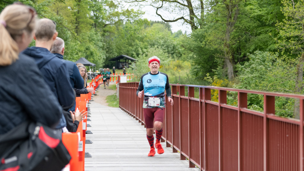 An older man running on the Uncovered Bridge
