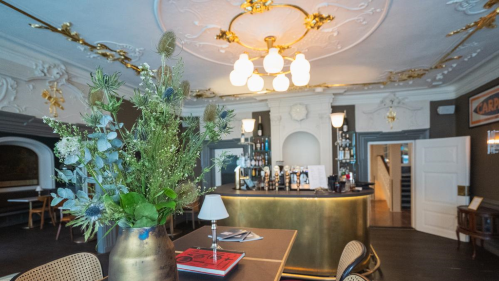 A bouquet of flowers in a vase at Jørgensens Hotel Wine Bar