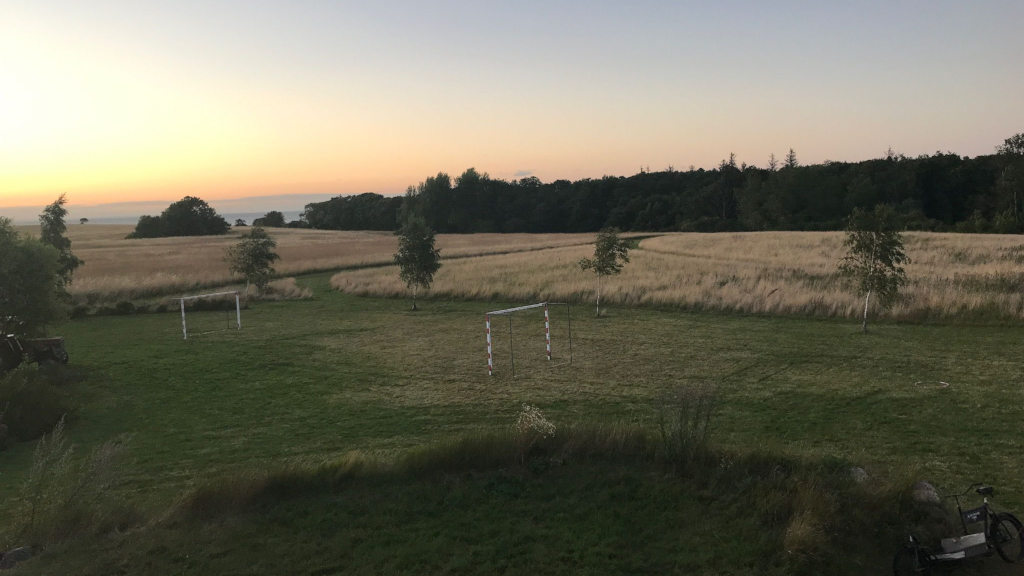 Sunset over the football field at Blåkærgård on Tunø