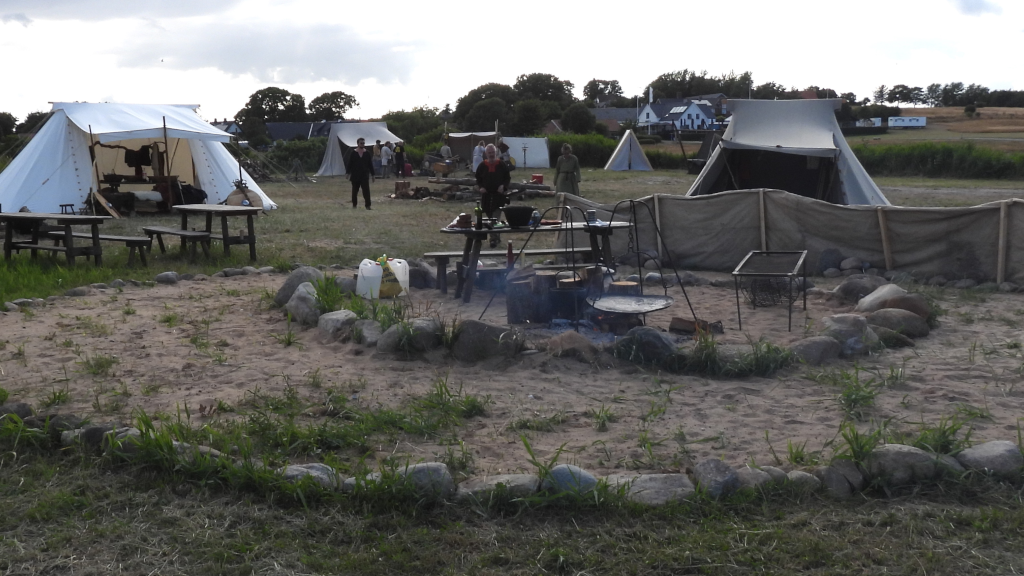 Campfire site and tents at the Tunø Viking Camp.