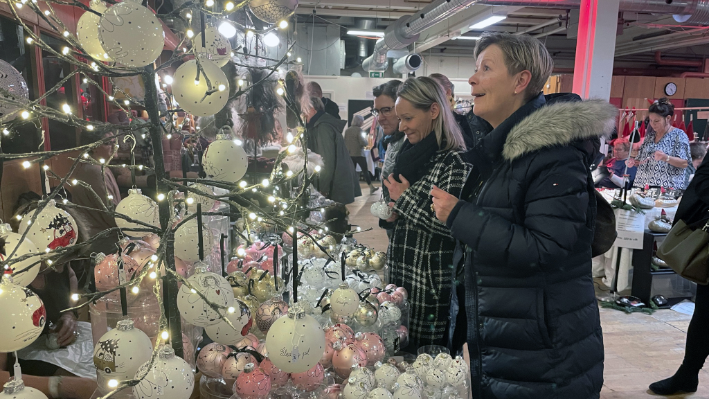 Women are looking at Christmas decorations at the Christmas market 'Jul på FÆNGSLET' in Horsens