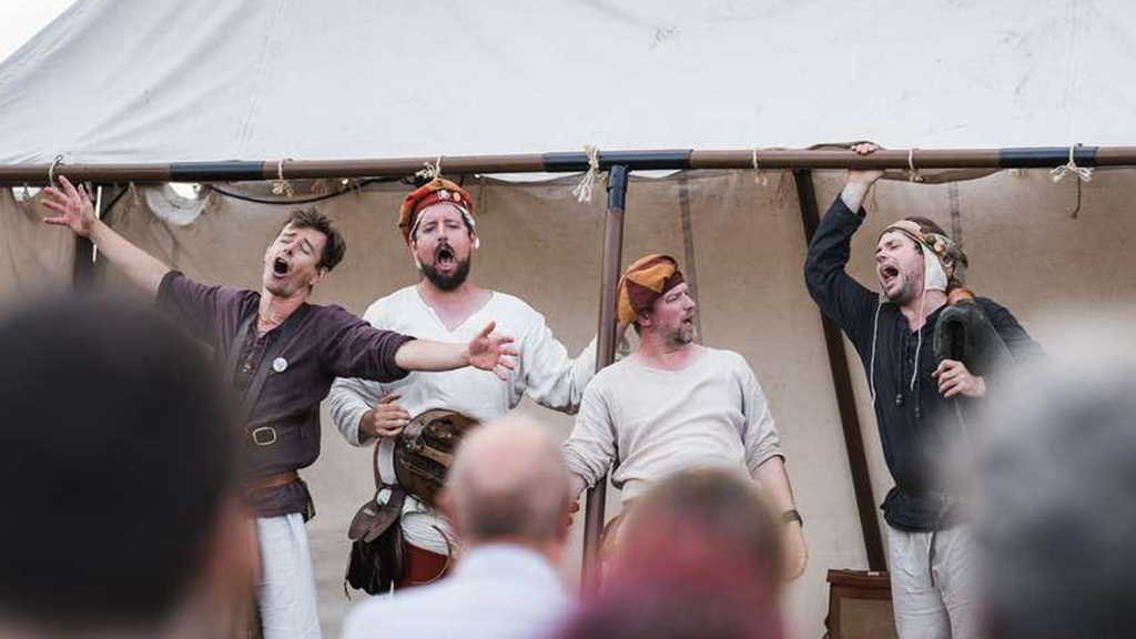A band in medieval costumes performing at the Horsens Medieval Festival
