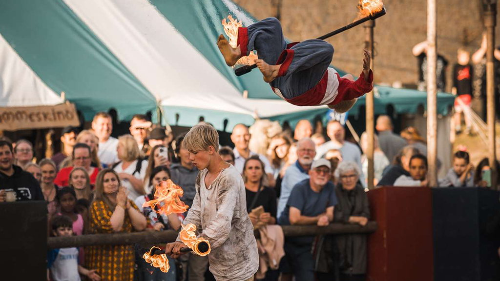 Children perform a fire show and do somersaults at the Horsens Medieval Festival