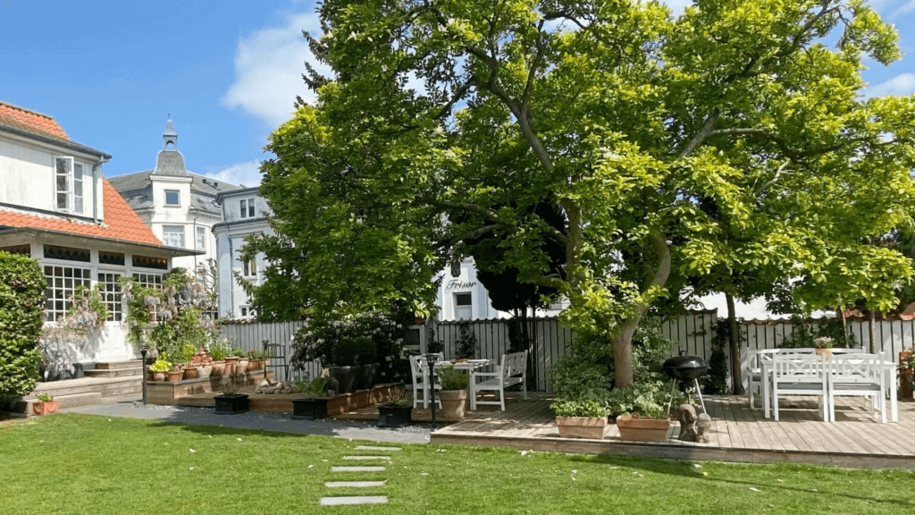 Large terrace in the garden at Holsteinshus B&B in Odder