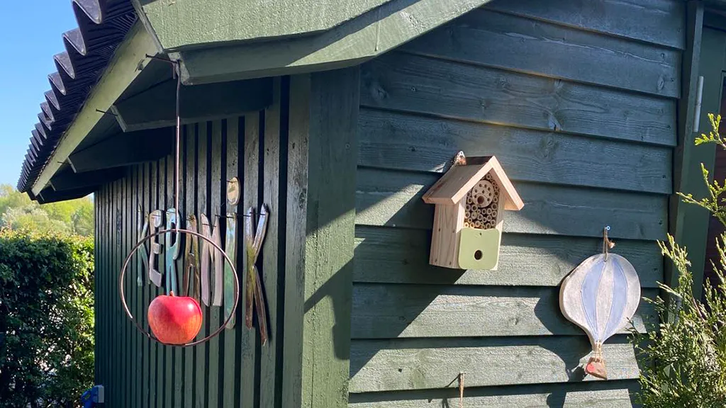 Ceramic decorations hanging on a shed at LM Unika Keramik