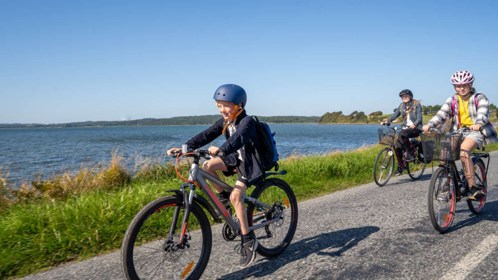 Mother and children cycling on the Alrø causeway