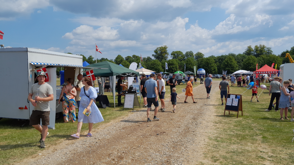 Men walking around the stalls at the agricultural fair in Horsens