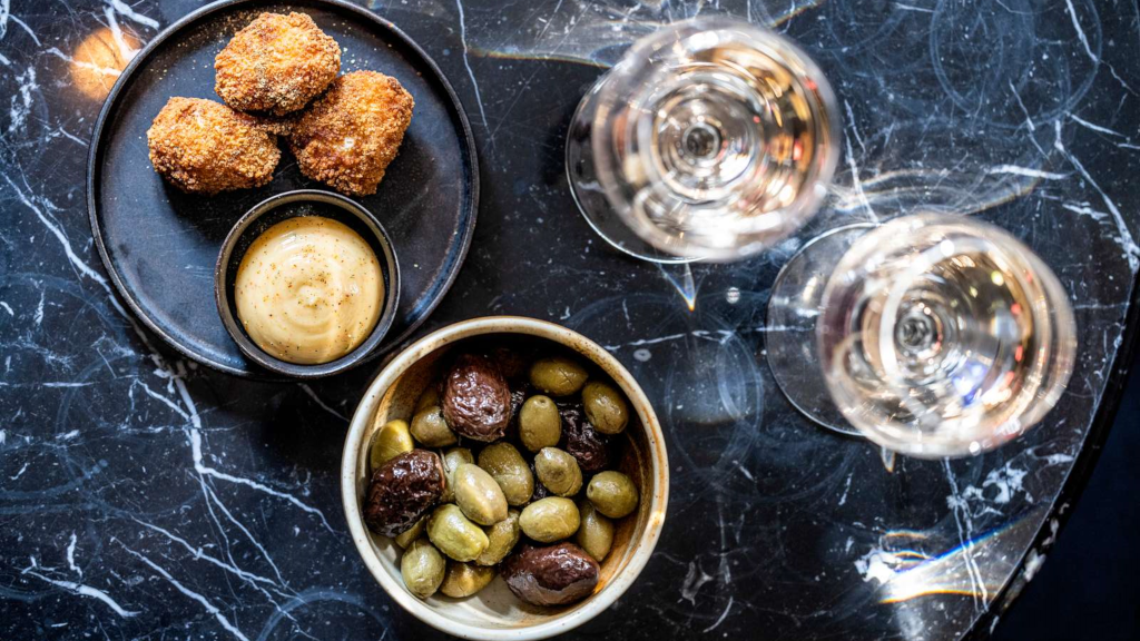 Snacks and white wine at Jørgensens Hotel Wine Bar