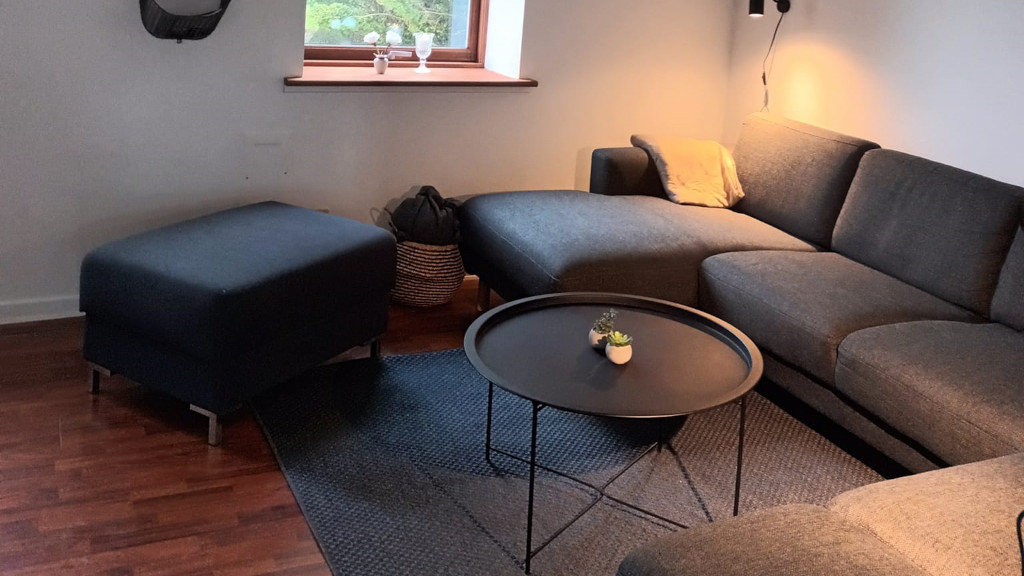 A large corner sofa in the living room at Mitlandidyl