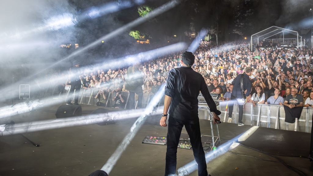 Lead singer Johan Olsen from Magtens Korridorer looks out over the audience at the concert in Lunden in Horsens