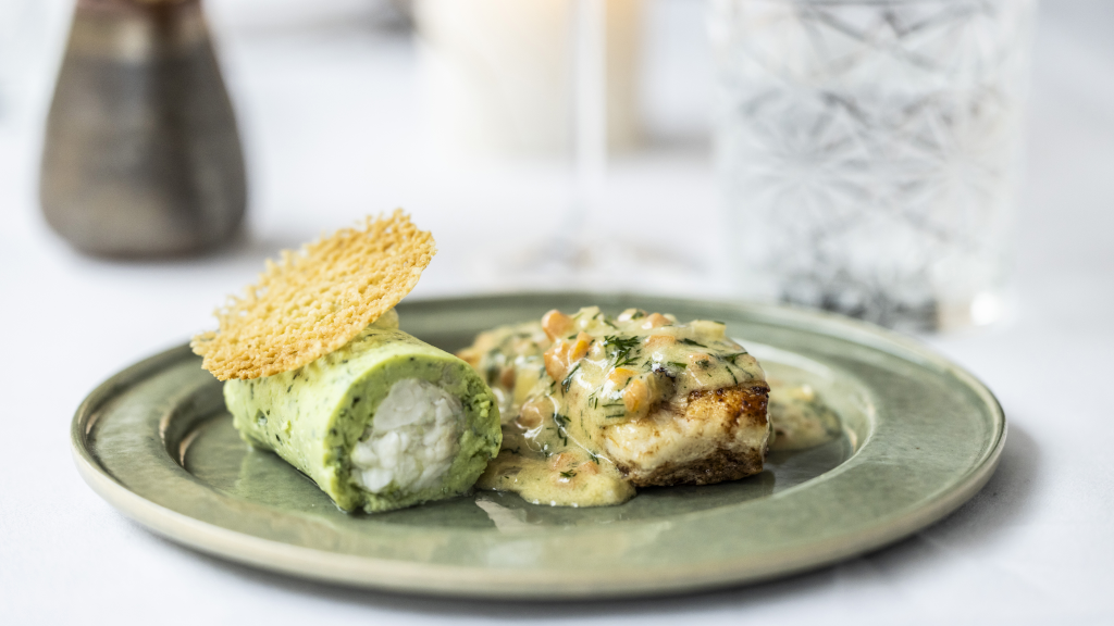 Plating of a dish with chicken at Ji-Mi's in Horsens