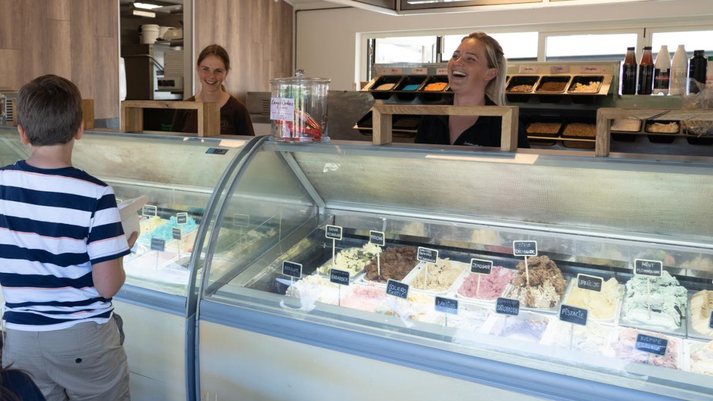 A boy looking at the ice cream selection at Havnens Café & Isbar in Juelsminde