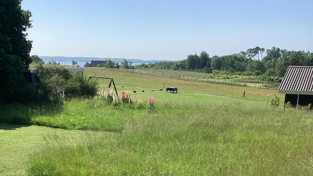 View from the garden at Anneks127 over fields and Horsens Fjord