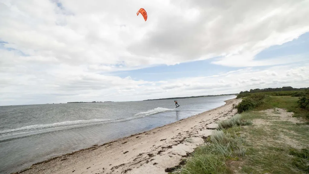 A kite surfer at the beach near Borre Knob