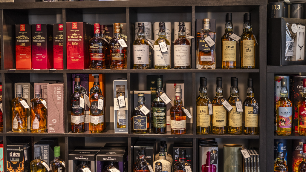 Whiskey bottles are displayed on the shelves at Water of Life in Brædstrup