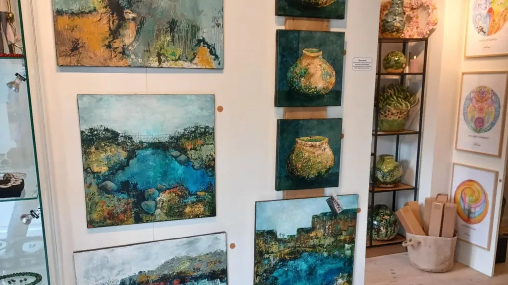 Landscape paintings on the walls in the gallery at Det Gamle Posthus on Tunø