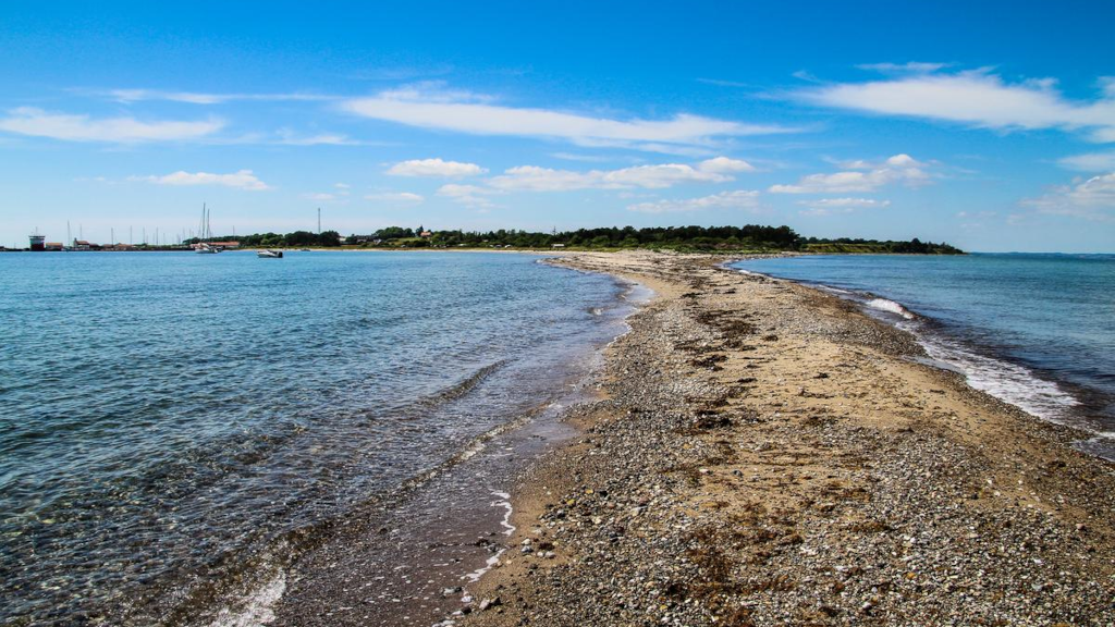 View towards the land and harbor from the tip of a long reef on Tunø