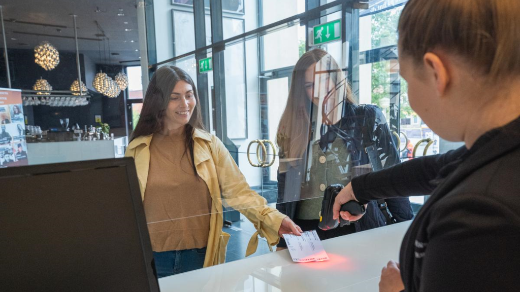 Two women have their tickets scanned at Horsens Ny Teater