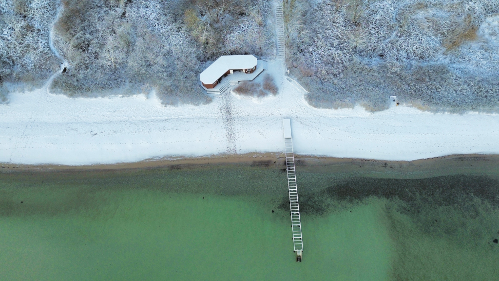 Drone photo of a snow-covered Rude Beach