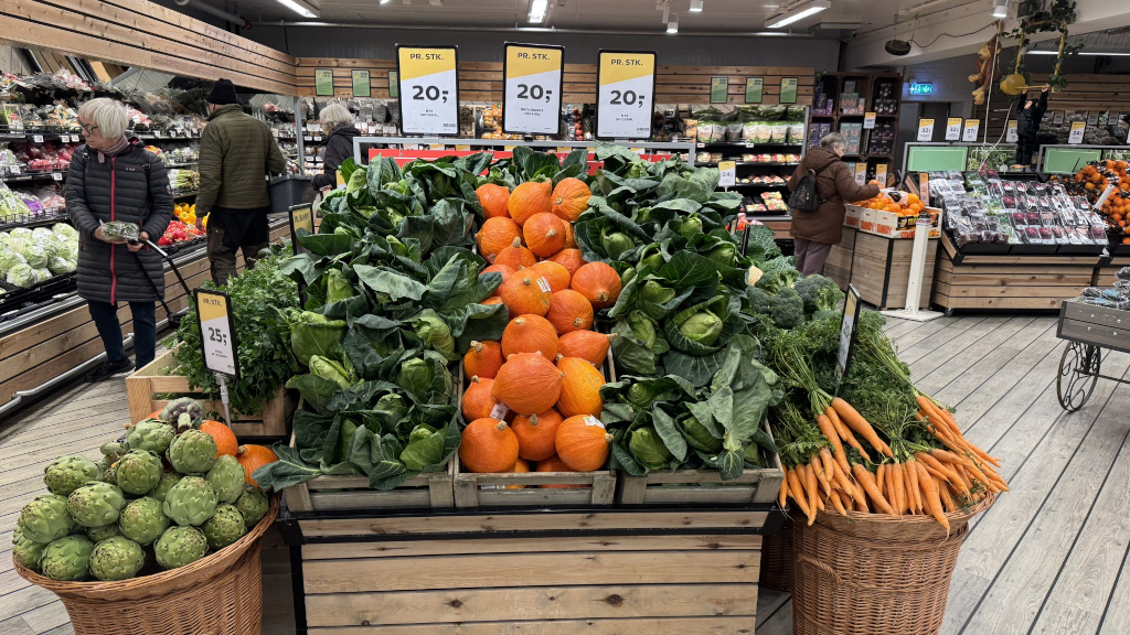 The produce section in Kvickly Odder with Hokkaido pumpkins and kale
