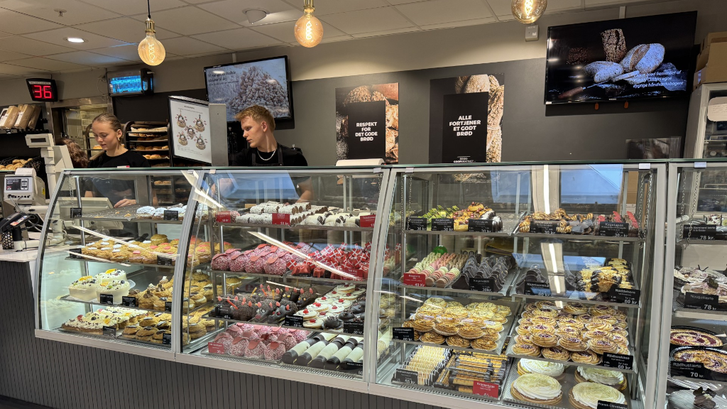 Cakes in the display case in the bakery at Kvickly Odder