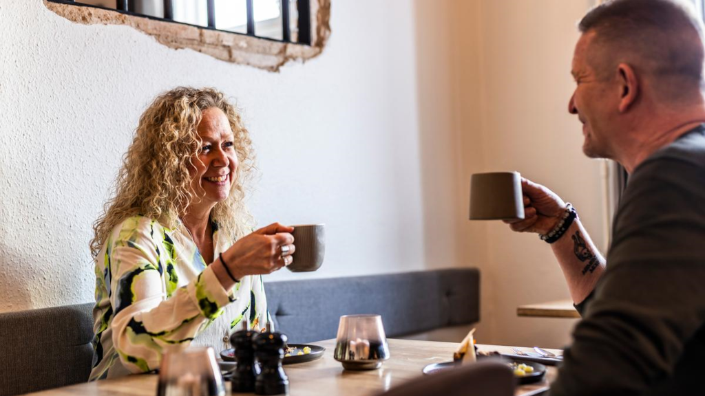 A couple toasts with coffee at Brasseriet FÆNGSLET