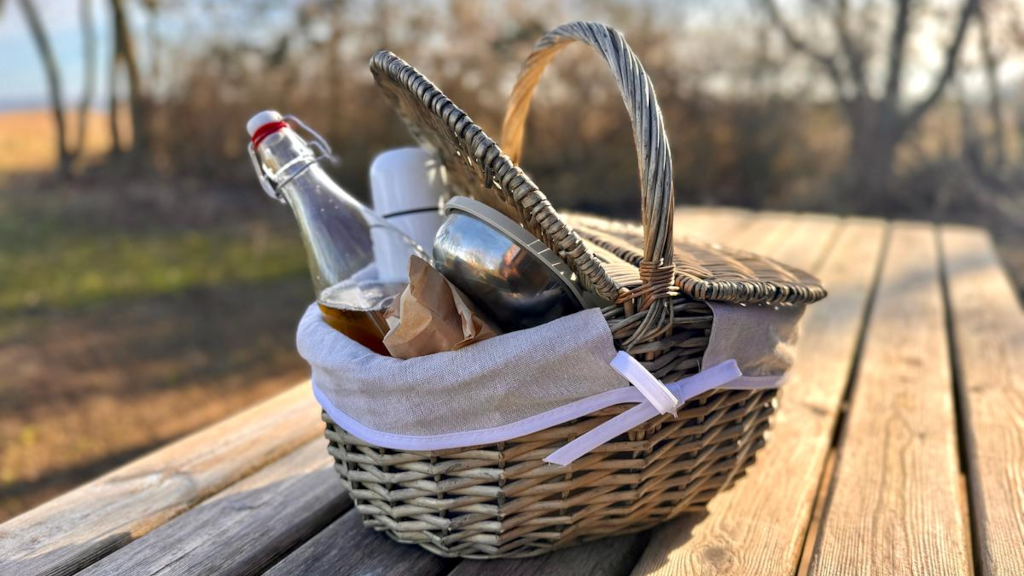 A breakfast basket with breakfast and juice at Campingpladsen Endelave