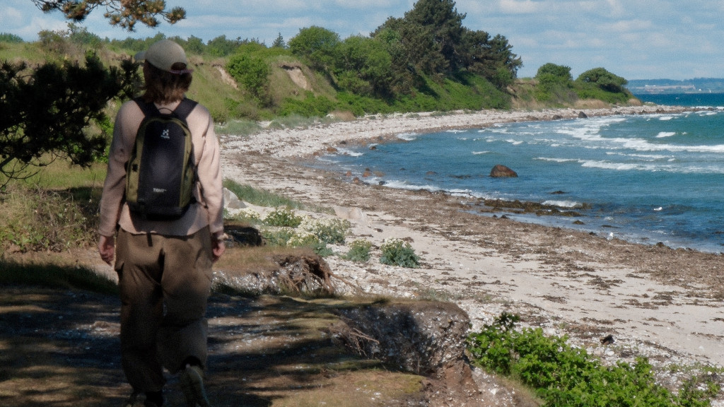 A man hiking along the beach on the north shore