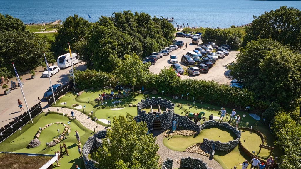 Horsens City Camping seen from above, with the sea visible in the background.