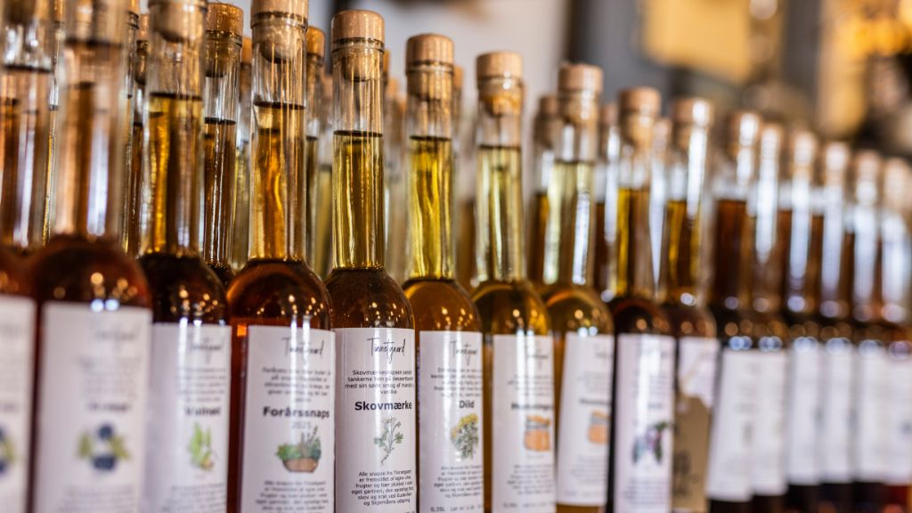 Glass bottles filled with homemade schnapps in many different flavours.