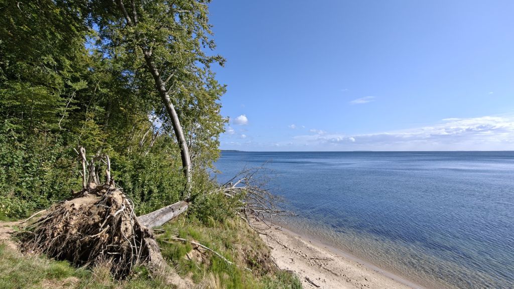 Stenhøj Beach by Staksrode Forest on a beautiful spring day with blue skies and sunshine.