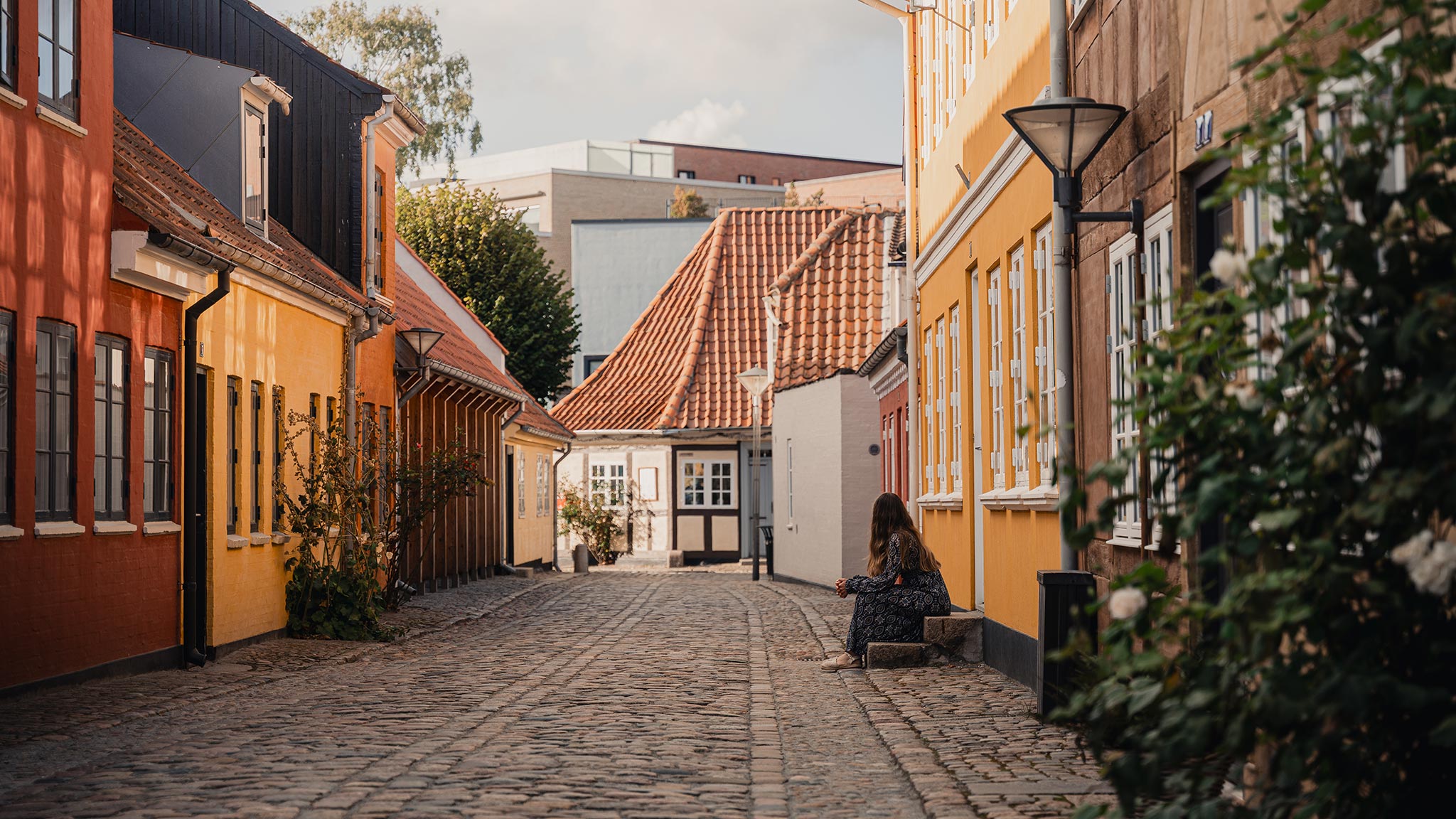Girl on stone steps in the old town