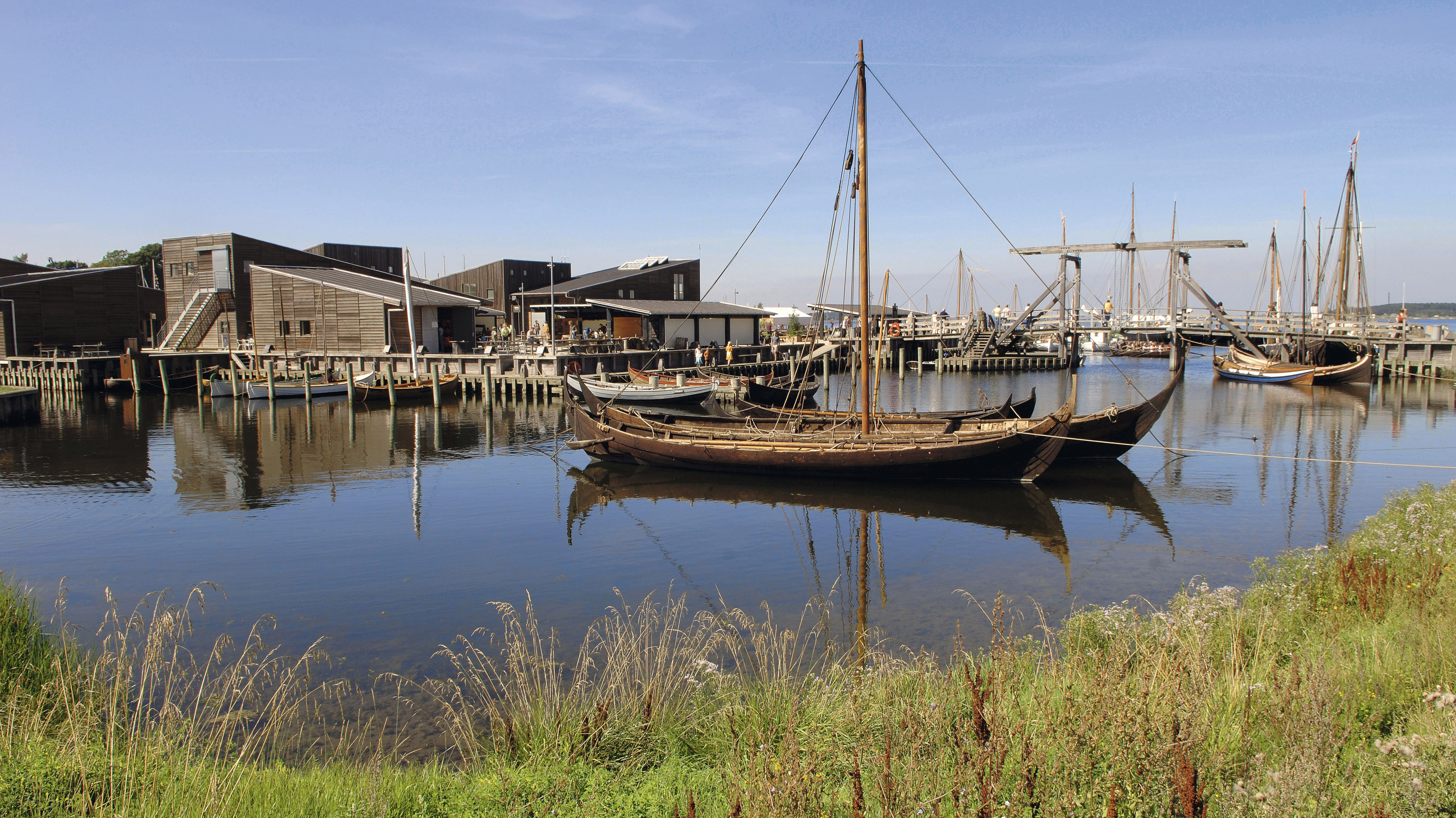Wooden vessels and the boatyard at the Viking Ship Museum harbour