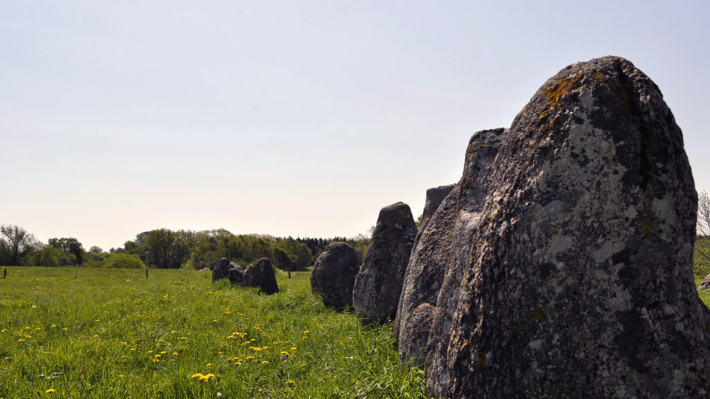 Large stones in the ship-shaped monument in the landscape at Gl. Lejre.