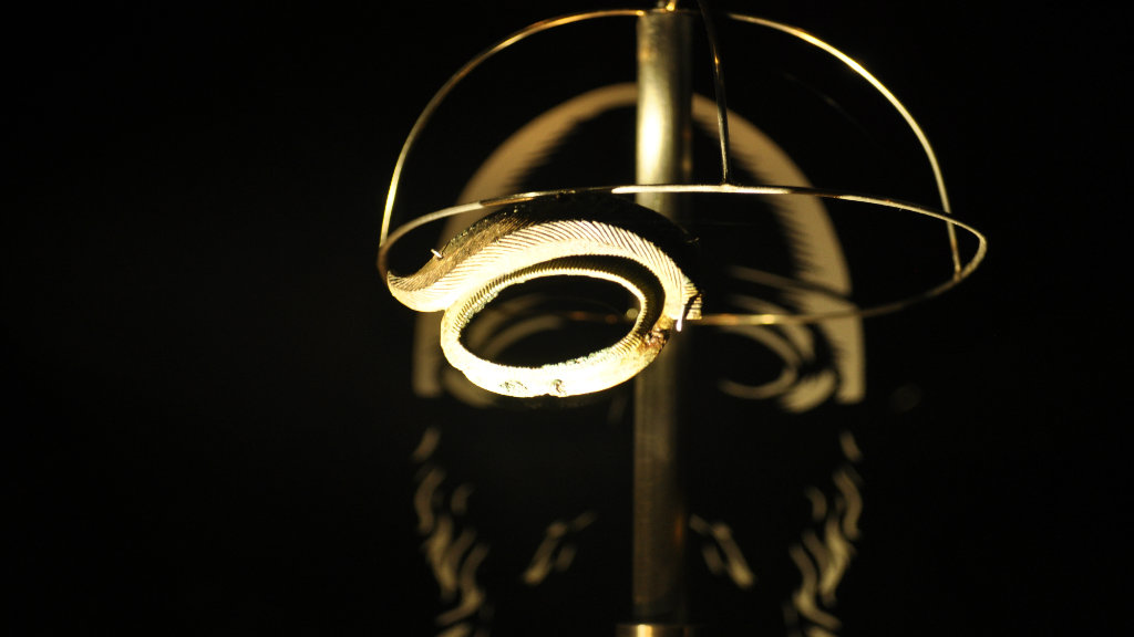 Decorated helmet eye-piece in the exhibition at Lejre Museum.
