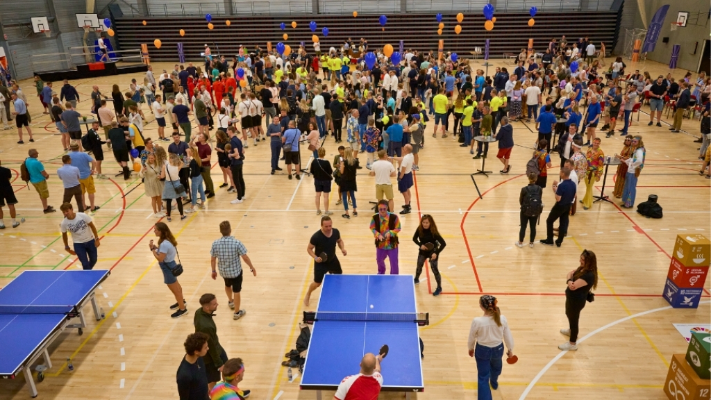 Sports hall at Roskilde Kongres- og Idrætscenter filled with people during an event.
